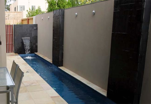 stone cladding in backyard water feature