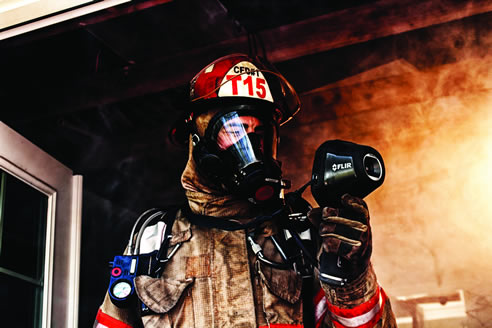 firefighter with thermal imaging camera
