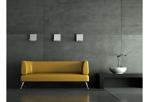 concrete veneer feature wall with yellow lounge