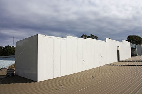 noise attenuation barrier for rooftop air conditioning