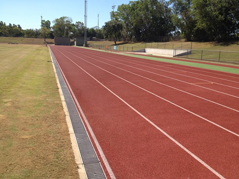 athletic track surface water drain