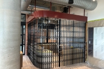 	Curved Retractable Security Doors for Commercial Interiors	