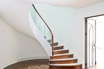 	Winding Staircase with Curved Glass Balustrade by S&A Stairs	