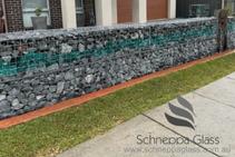 	Gabion Fence With Landscaping Glass Feature by Schneppa Glass	