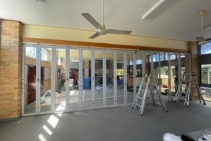 	Folding Glass Door System for Flexible Commercial Partitioning by ATDC	