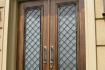 	Iron Entrance Door with Glass Backing by Budget Wrought Iron	