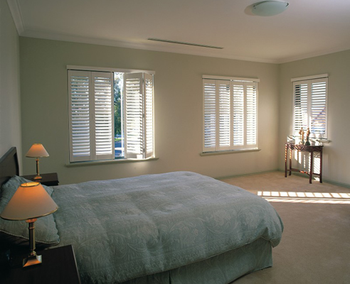 plantation shutters in bedroom