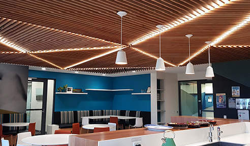 SUPASLAT creative slatted ceiling gives warmth to a staff breakout.