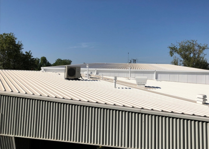 Reducing Heat Load for School Roofs by Cocoon Cool Roofs