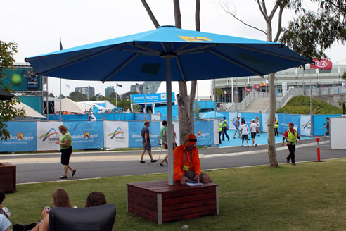 shade umbrella with combined seating at australian open