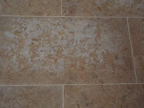 efflorescence on limestone tiles