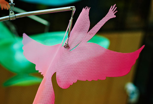 pink perforated metal bird