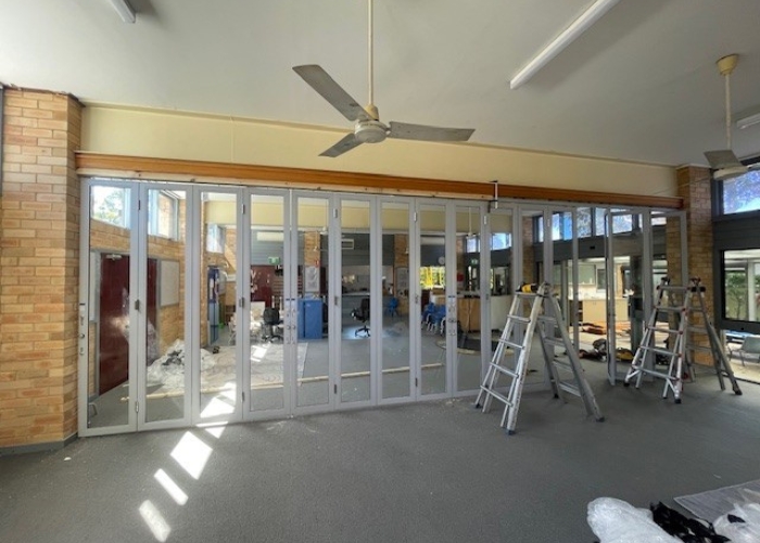 Folding Glass Door System for Flexible Commercial Partitioning by ATDC