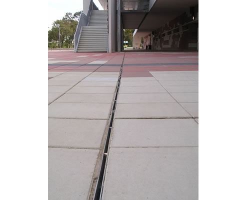 discrete surface drainage system for paved area