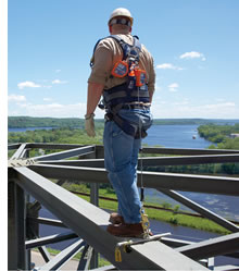 man with self retracting lifeline with foot level tie-off