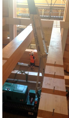 mini crane installing indoor timbers on suspended slab