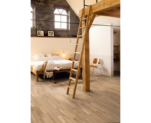 loft bedroom with quick-step floor