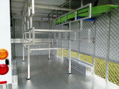 racks inside custom built surf life saving trailer