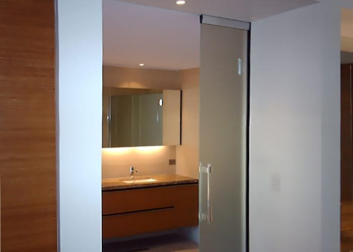 Flush Set Top Track Frameless Glass Partition by Smooth Door Systems