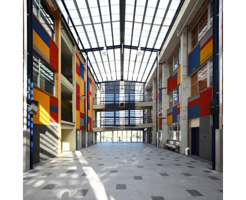 two buildings being joined by an atrium ceiling