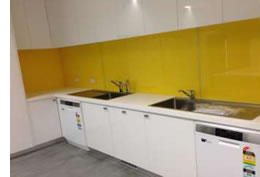 yellow acrylic kitchen splashback