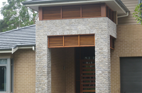 textured stone cladding facade feature