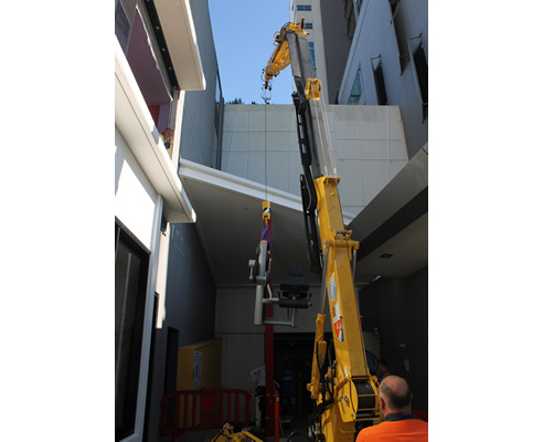 mini crane replacing glass roof