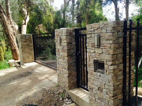 stone panel clad fence