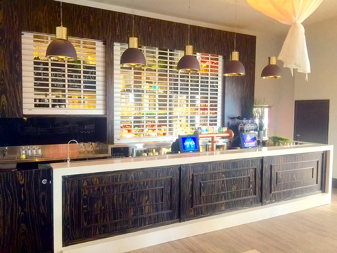 Bar with timber veneer with solid timber stained datto rails