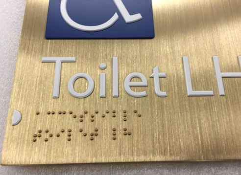 brass braille sign