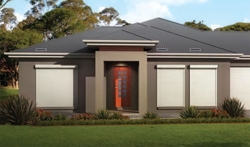 house with automated window roller shutters