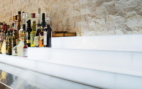 textured cream limestone behind bar