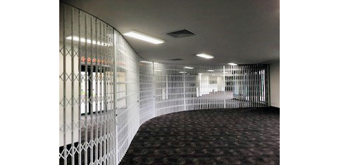 Curved commercial security screen from Trellis Door Co