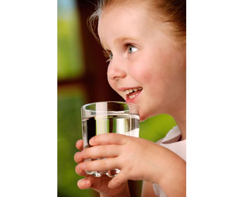 girl drinking glass of water