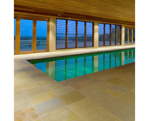 tumbled limestone pool surround paving