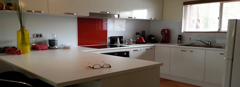 red and white acrylic splashback