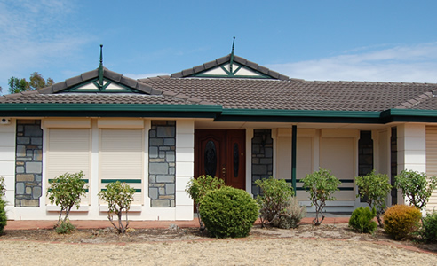 house with aluminium roller shutters