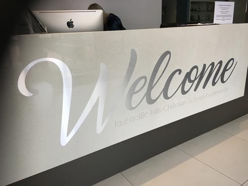 reception desk welcome signage