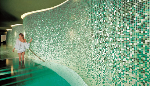 green mosaic tiled curved walls