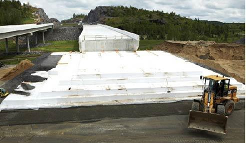 Polystyrene void-filling material for road embankment