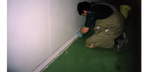 man installing wall skirting