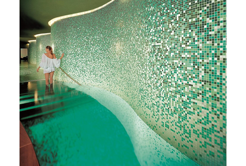 green curved mosaic walls