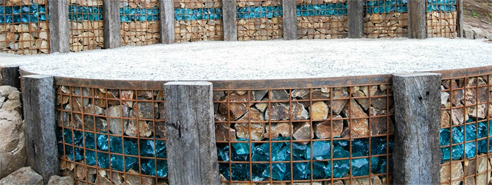 gabion wall with coloured glass landscaping rocks