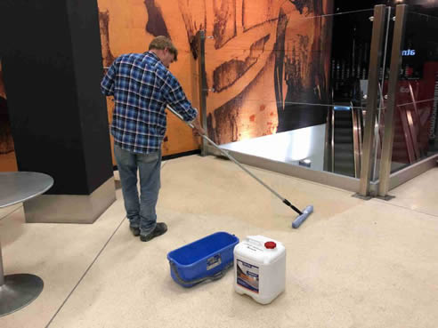 applying Lithium Densifier Premium concrete floor sealer