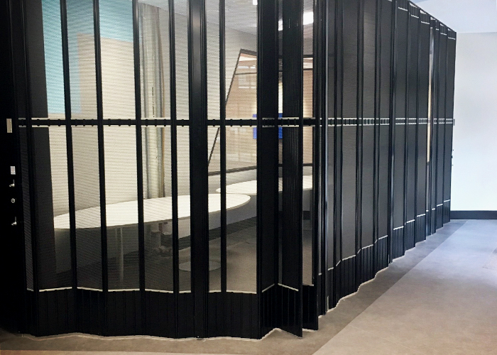 Perforated Folding Closure Doors for Security from Trellis Door Co
