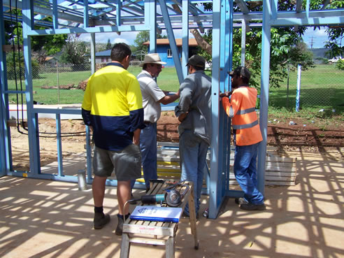 men inside steel framed house