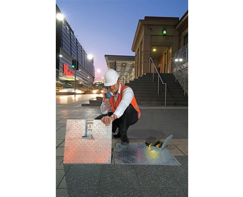 pit locking system on street with man