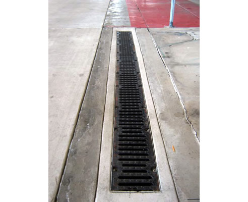 concrete channel and iron grate