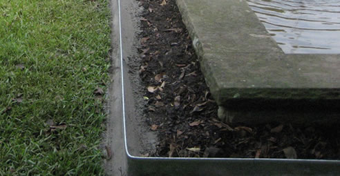 metal garden edging with concrete footing