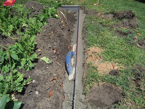 concrete footing for metal garden edging